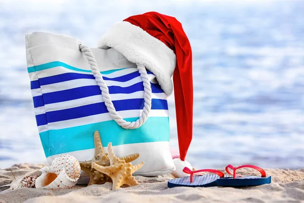 Composition Beach Bag Santa Hat Sea Shore Christmas Vacation Concept — Stock Photo, Image