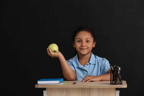 Little African American Pupil Sitting School Desk Dark Background — Stock Photo, Image