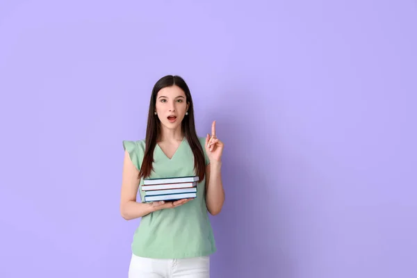 Hermosa Mujer Joven Con Libros Dedo Índice Levantado Fondo Color — Foto de Stock