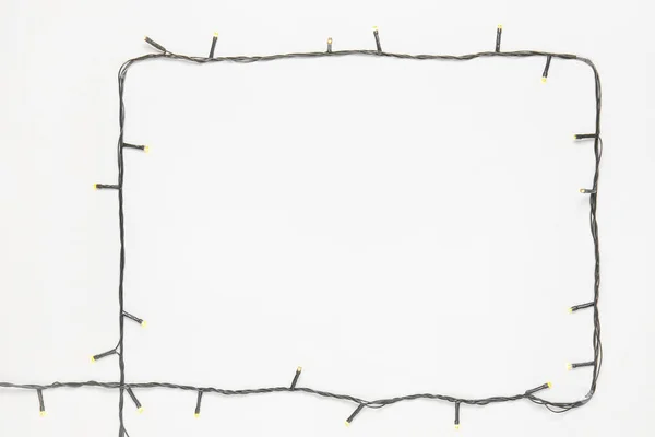 Rahmen Aus Weihnachtsbeleuchtung Auf Weißem Hintergrund — Stockfoto