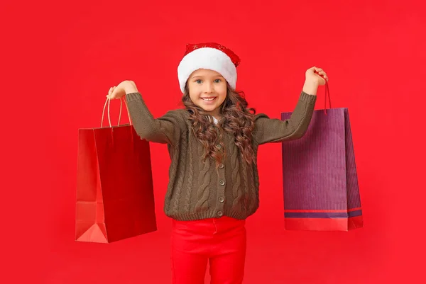 Cute Little Girl Santa Hat Shopping Bags Color Background — Stock Photo, Image