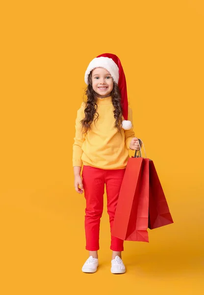 Cute Little Girl Santa Hat Shopping Bags Color Background — Stock Photo, Image