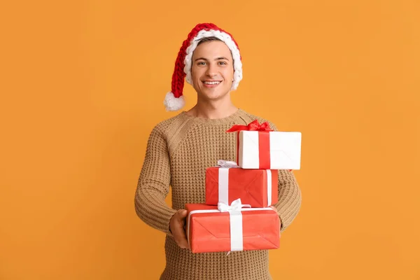 Handsome Man Santa Hat Gift Boxes Color Background — Stock Photo, Image