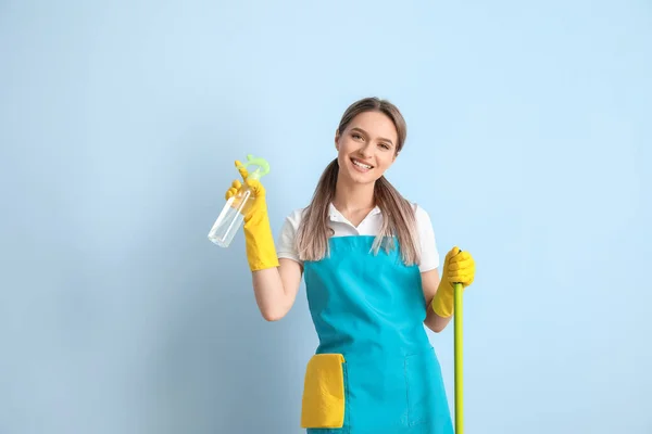 Young Woman Cleaning Supplies Color Background — Stock Photo, Image