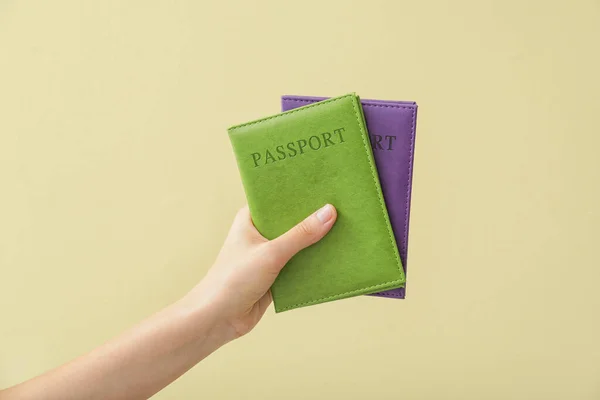 Female Hand Passports Color Background — Stock Photo, Image