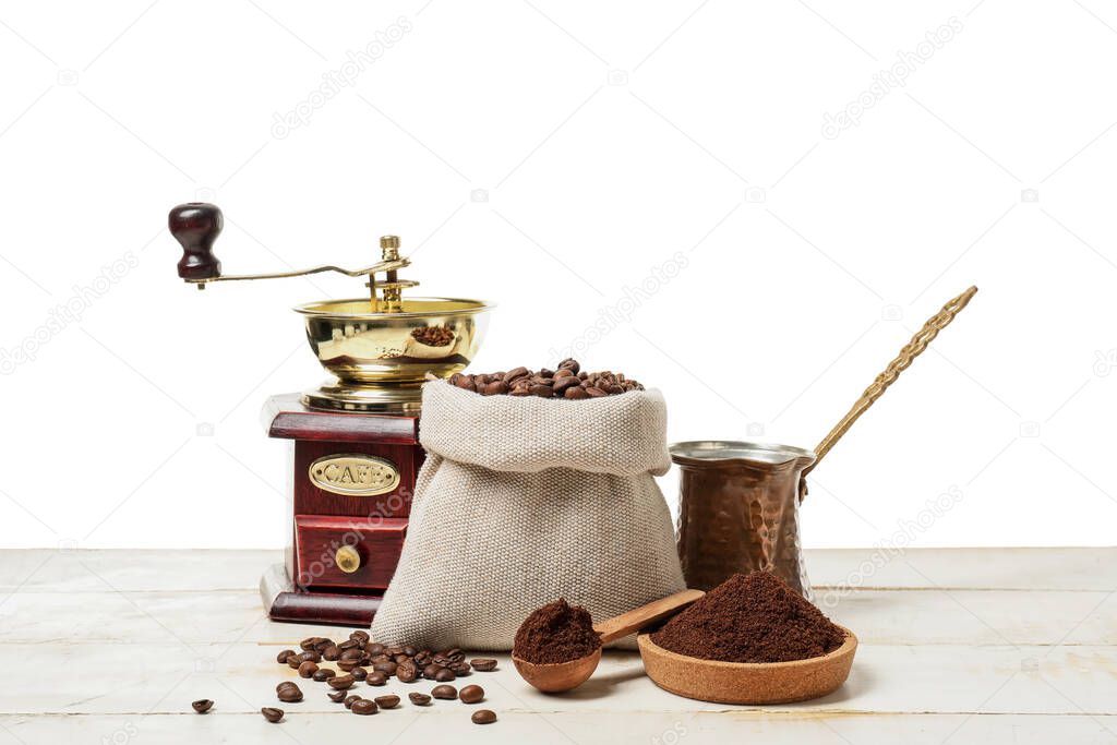 Composition with coffee beans on table against white background