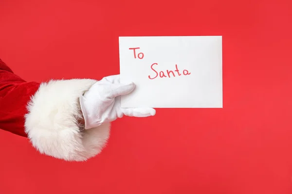 Рука Санта Клауса Буквой Цветном Фоне — стоковое фото