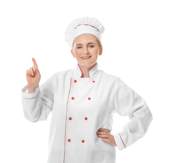 Maduro Chef Feminino Apontando Para Algo Fundo Branco — Fotografia de Stock