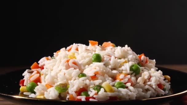 Rotating Plate Tasty Boiled Rice Vegetables Dark Background Closeup — Stock Video