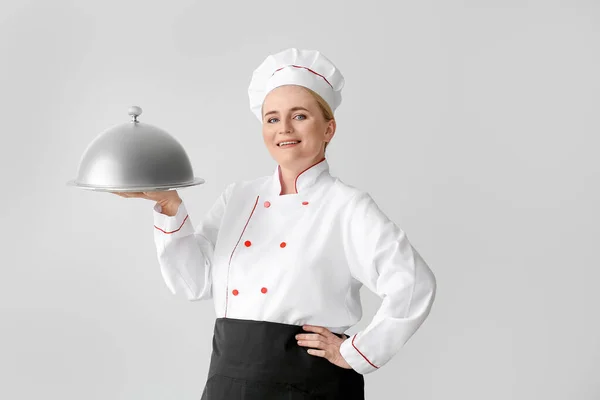 Mature Female Chef Tray Cloche Grey Background — Stock Photo, Image