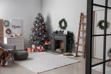 Decorated fireplace in interior of room on Christmas eve clipart