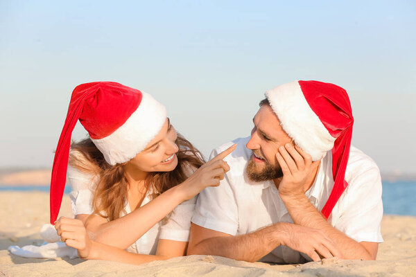 Happy couple celebrating Christmas at tropical resort