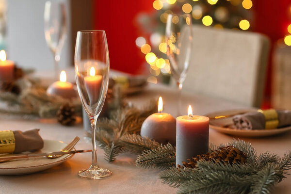 Beautiful table setting with Christmas decorations in living room