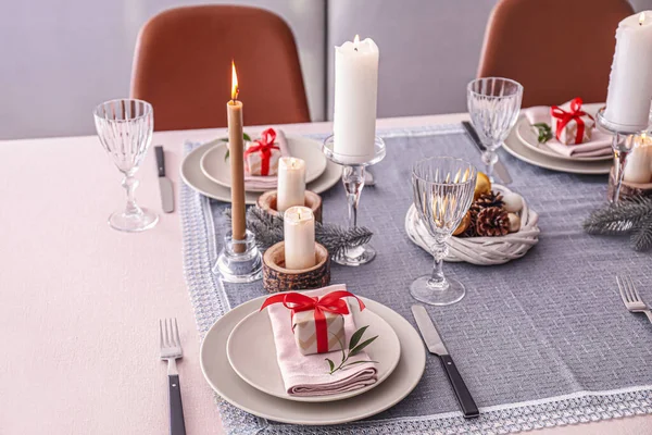 Beautiful table setting with Christmas decor in living room