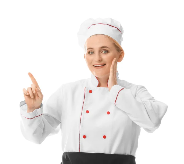 Maduro Chef Feminino Apontando Para Algo Fundo Branco — Fotografia de Stock