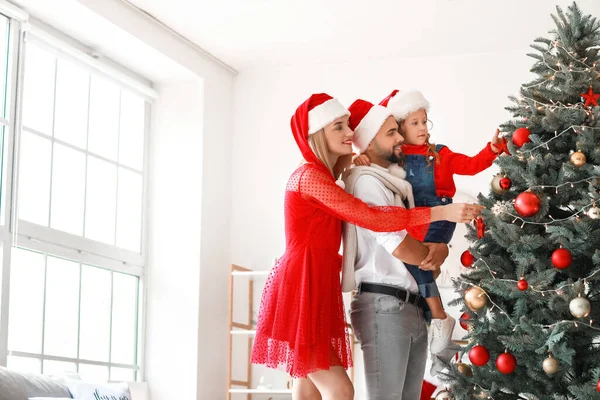 Young Family Decorating Christmas Tree Home — Stock Photo, Image