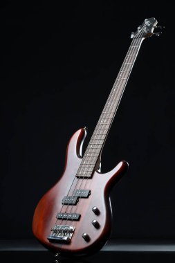 Modern electric guitar on black background