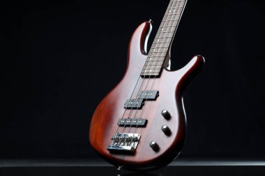 Modern electric guitar on black background