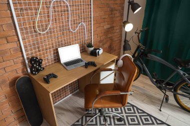 Interior of children's room with workplace, glowing lamp and bicycle
