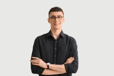 Handsome businessman in black shirt on white background