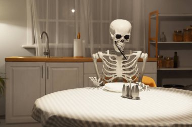 Human skeleton model with fork near dining table in kitchen at night