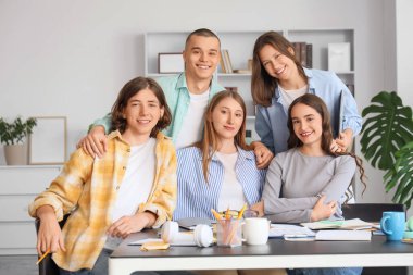 Group of students at table in library