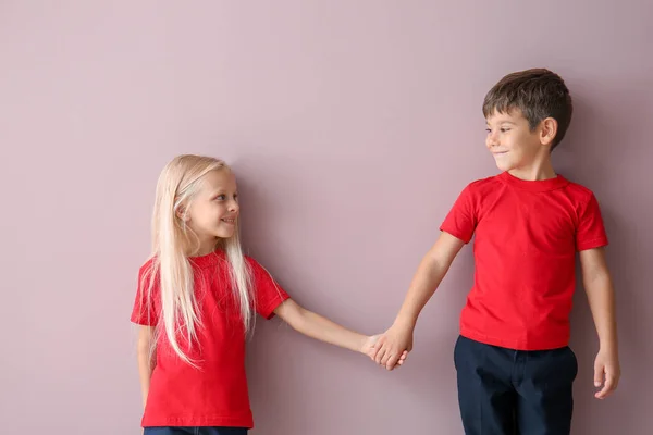 Boy And Girl In T Shirts Holding Hands On Color Background Image Copy Stock Photo