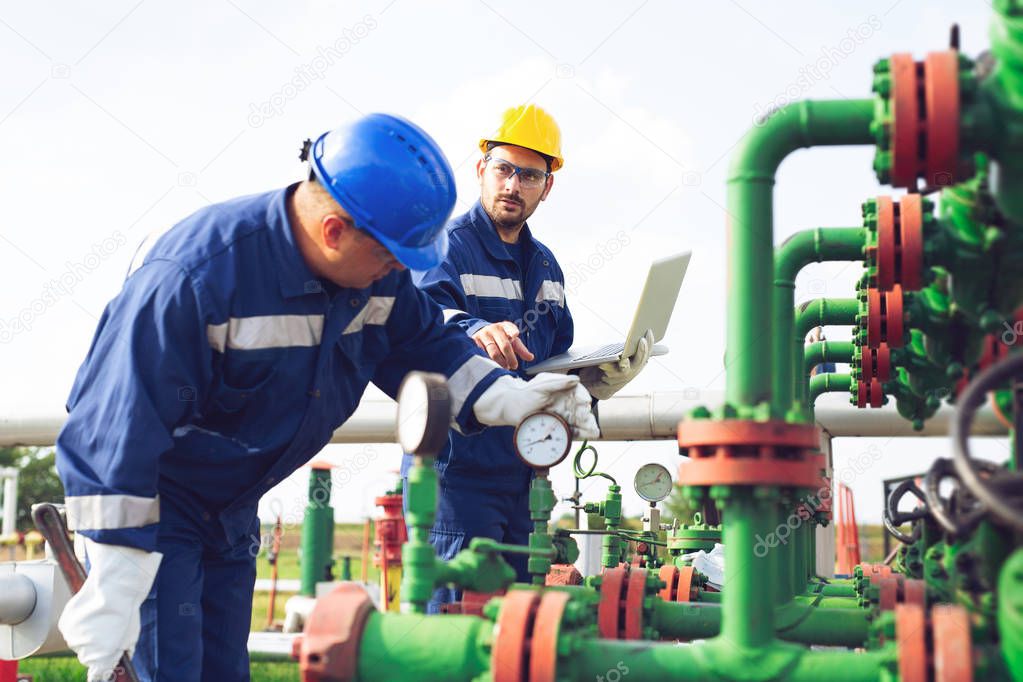 Petrochemical workers working at refinery plant