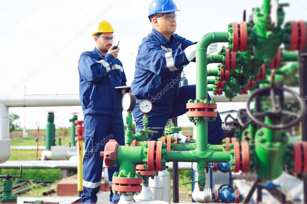 Petrochemical workers working at refinery plant