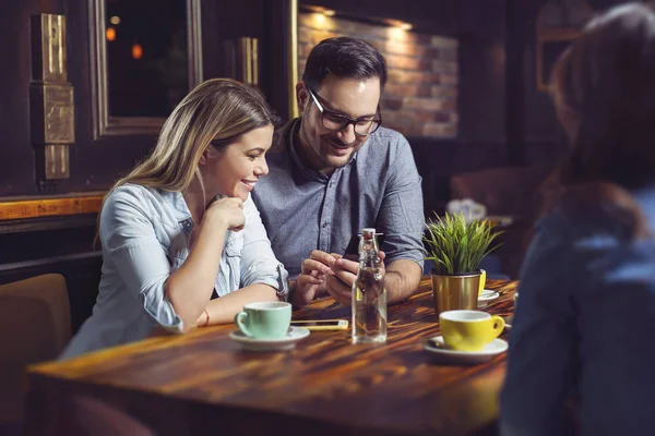 Young Happy Couple Having Coffee Cafe Looking Phone — Stock Photo, Image