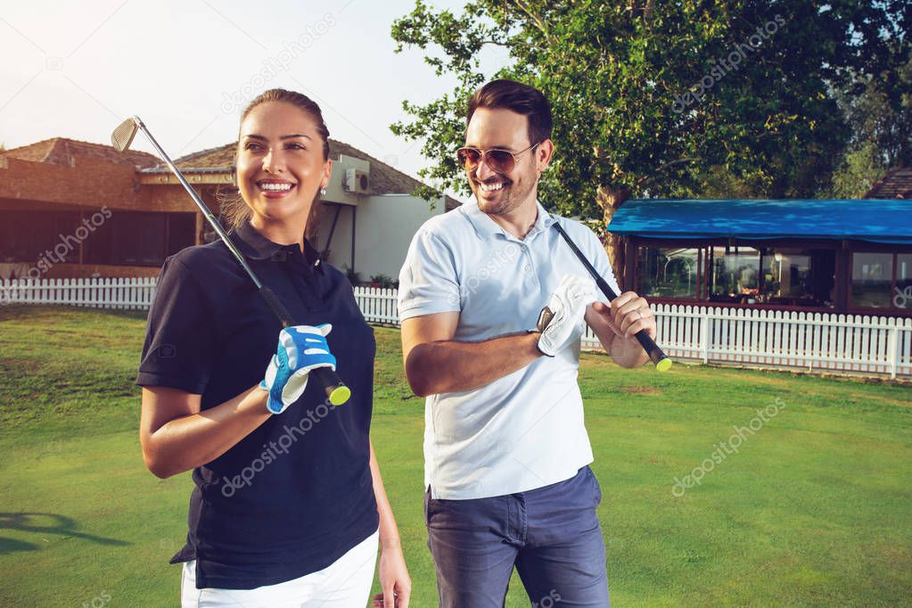 Happy couple feeling happy after golf game