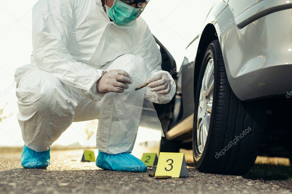 Forensic Science. Criminologist investigates a crime scene.