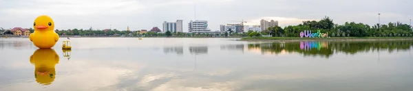 Udon Thani, Thailand - June 24, 2019 : panorama of yellow giant inflatable duck and yellow boat on the lake in Nong Prajak Park — Stock Photo, Image