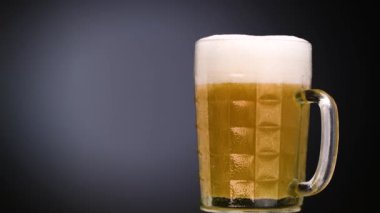 Glass Beer on Blue Light Background 