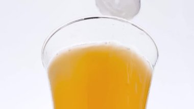 Ice Cubes Drop Into Orange Juice Slow Motion
