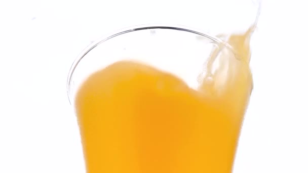 Ice Cube Falling Orange Juice — Stock Video