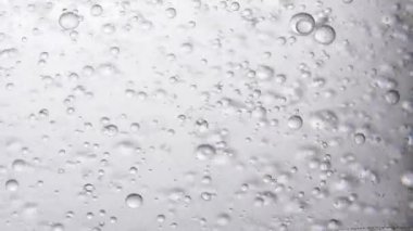 Hareket eden gri baloncuklu soyut arkaplan 