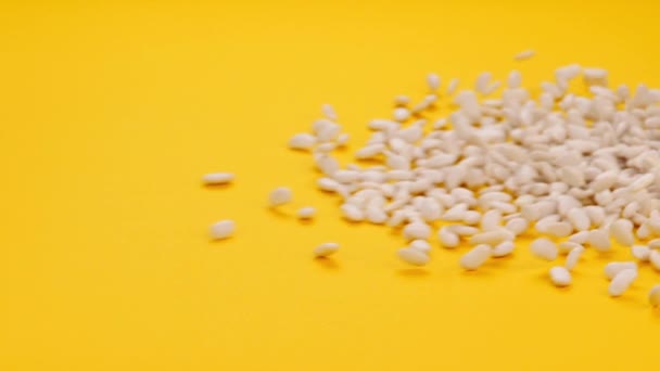 White Beans Falling Yellow Background — Stock Video