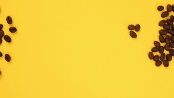 Stop Motion Video Coffee Beans Making Heart Shape Yellow Background — Stock Video