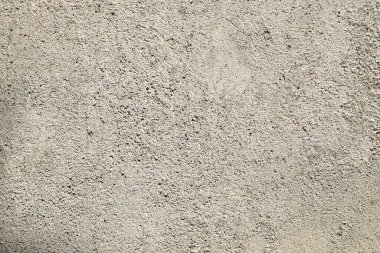 Etrafa dağılmış birkaç küçük taşla beyaz bir arka plan. Kayaların boyutları ve şekilleri farklıdır.