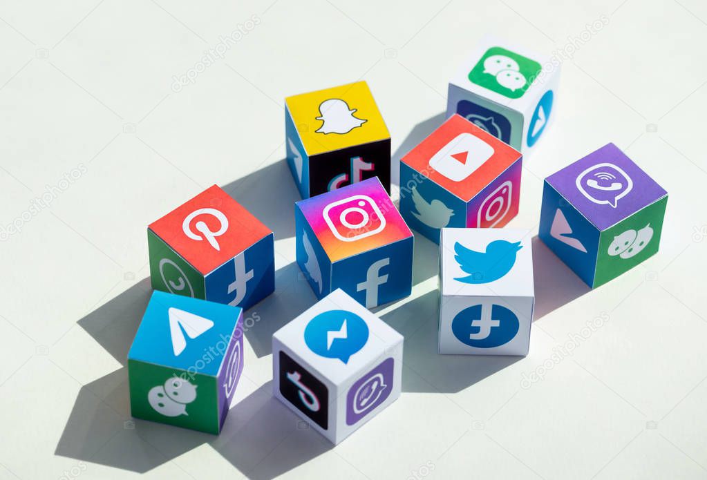 Kyiv, Ukraine - September 5, 2019: A paper cubes collection with printed logos of world-famous social networks and online messengers, such as Facebook, Instagram, YouTube, Telegram and others.
