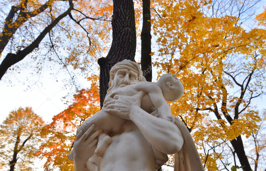 The God Saturn statue in Summer Garden at autumn evening, St.Petersburg, Russia.