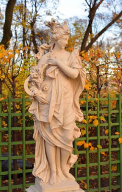 Statue of goddess Ceres in Summer Garden at autumn evening, St.Petersburg, Russia. Roman goddess of harvest and fertility clipart