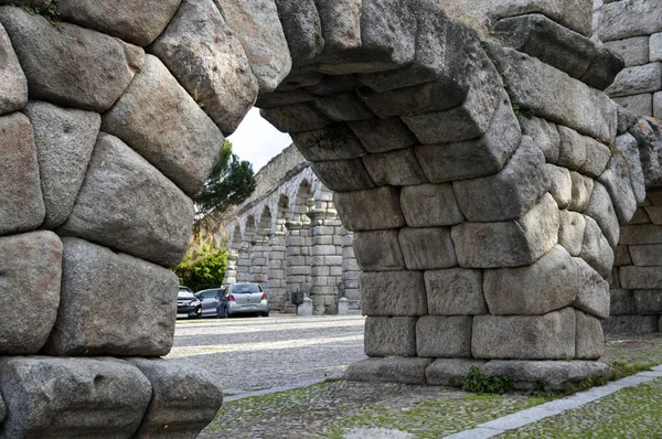 Stone arch of the ancient Roman aqueduct in Segovia.