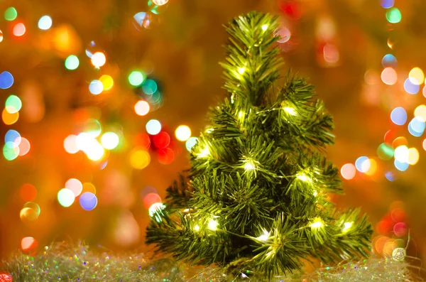 Christmas Card Green Tree Blurred Garland Lights — Stock Photo, Image