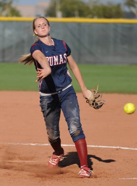 Girls High School Softball game action being played at a high school level in Arizona. The game was played at a local school in Gilbert Arizona which is located in the Southwest part of the United States. clipart
