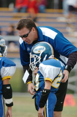  Warner Gençlik futbol eylem pop. Pop Warner Birleşik Devletler futbol oyun arkadaşları içinde en büyük ve en eski genç futbol ligi olduğunu.