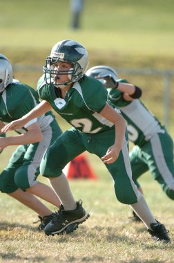  Warner Gençlik futbol eylem pop. Pop Warner Birleşik Devletler futbol oyun arkadaşları içinde en büyük ve en eski genç futbol ligi olduğunu.