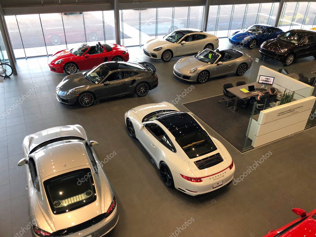 New Porsche car dealership selling cars in a Gilbert Arizona location in the Southwest part of the United States. Porsche AG is a German automobile manufacturer specializing in high-performance sports cars and SUVs.