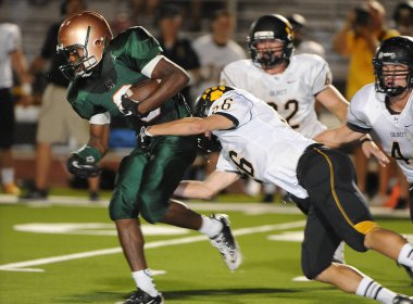 Arizona Doğu Vadisi oynanan bir normal sezon oyunları sırasında lise futbol oyun eylem. Yüksek okul futbol lise takım Amerika Birleşik Devletleri'nde oynadığı ızgara futbolcu.